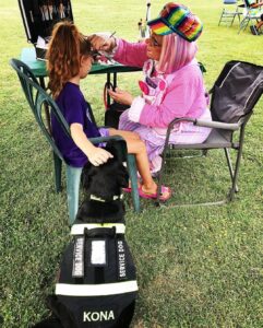 Service dog with child handler at an event in spokane Washington.