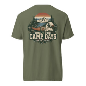 Built for Camp Days The Built for Camp Days shirt is made for dog people who feel most at home beside a campfire, a canoe, and a quiet mountain lake. Featuring a loyal dog resting in a vintage campsite setting, this design captures the easy rhythm of outdoor weekends, slow mornings, and adventures that end with muddy paws and good stories.